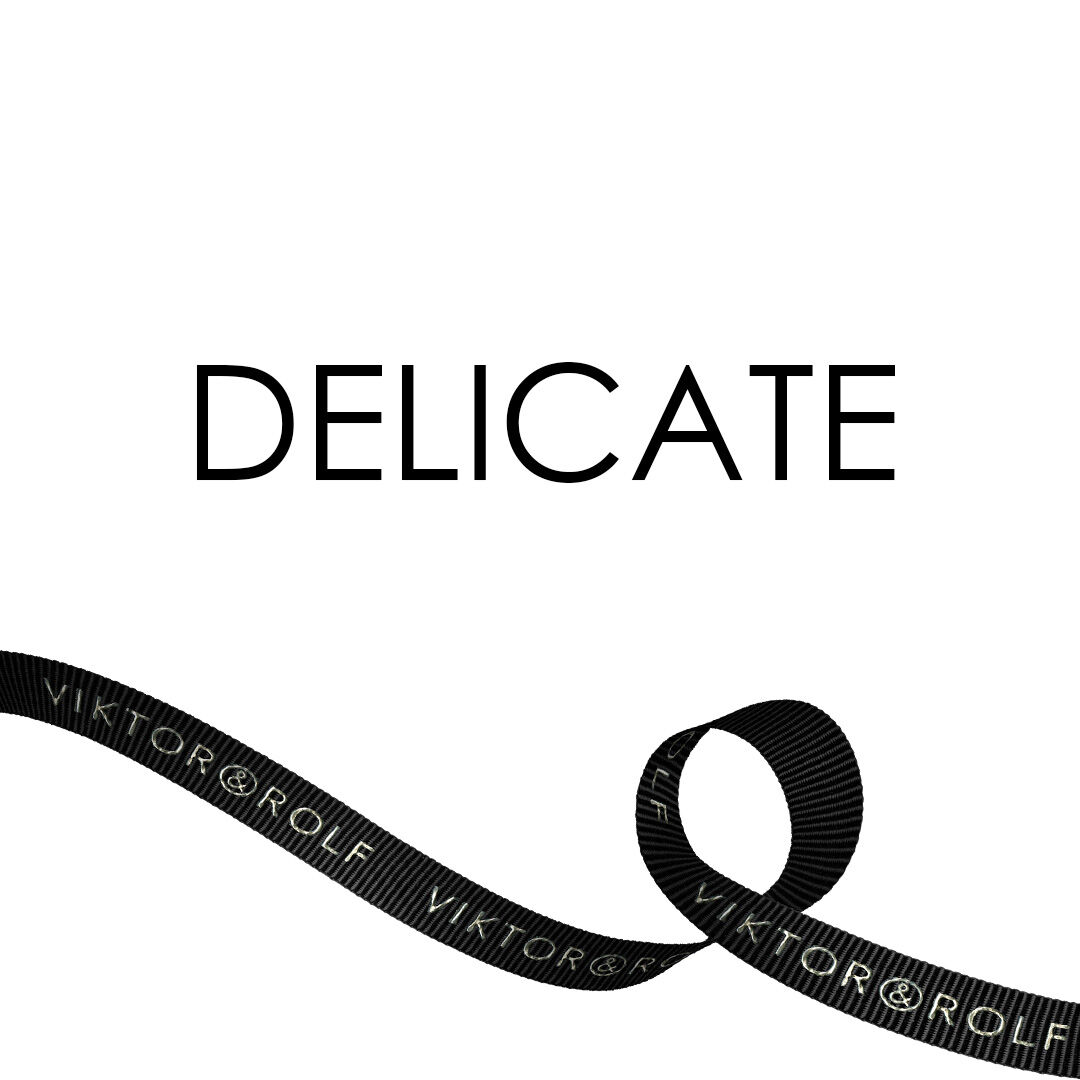 Delicate on white box with black Viktor & Rolf ribbon