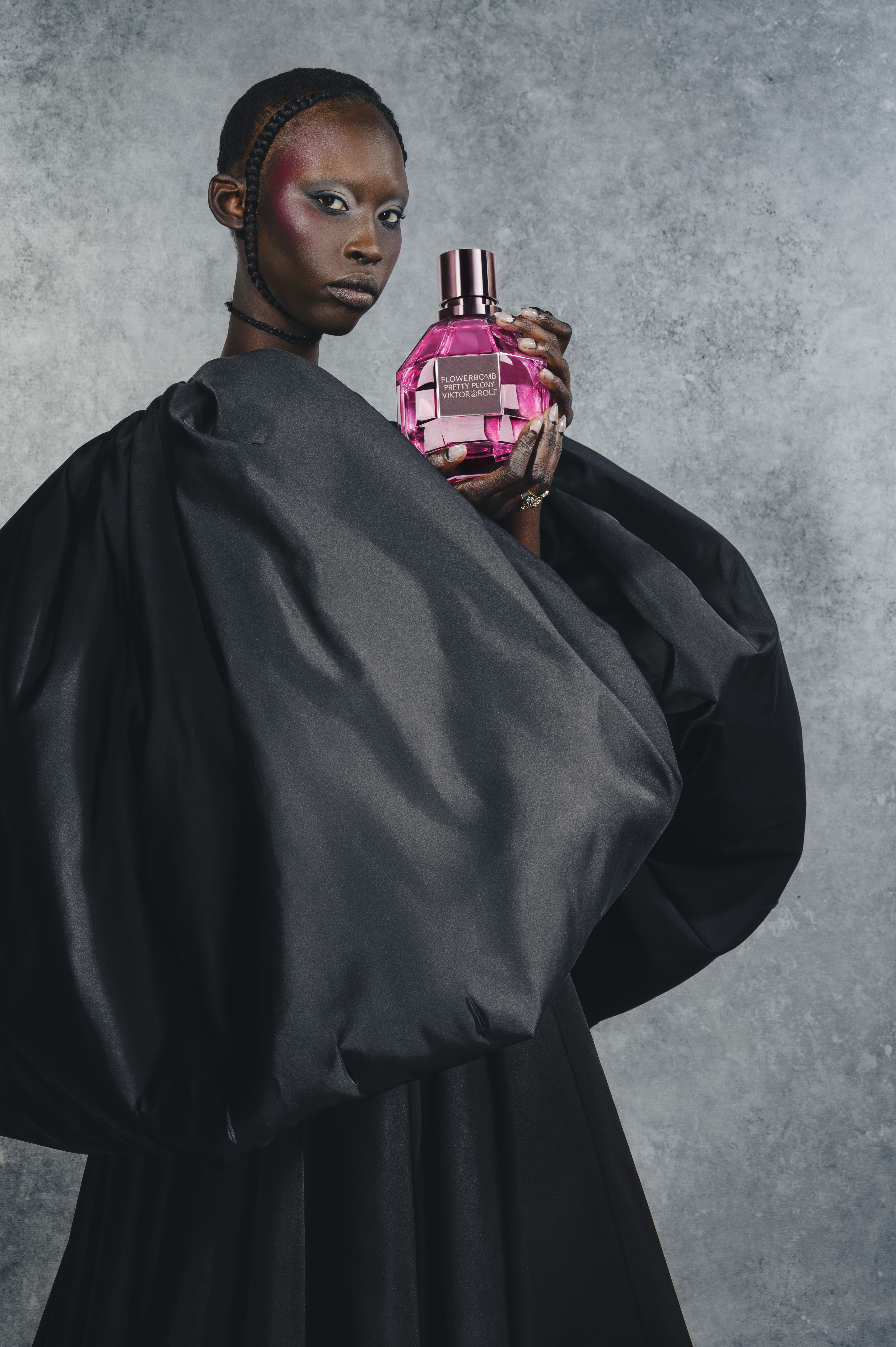 Model wearing white dress holding Flowerbomb Mariage Limited Edition Eau de Parfum  